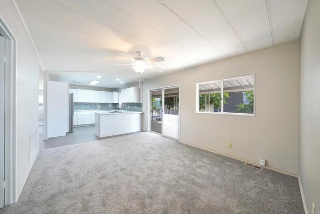 a view of a kitchen with a sink and a window