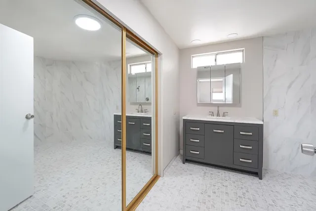 a view of a swimming pool and lounge chairs