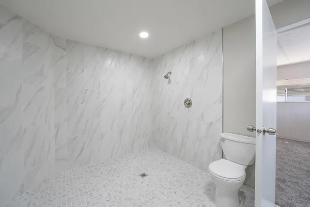 a view of a swimming pool with outdoor seating