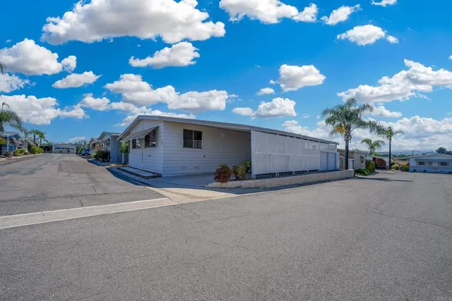 a view of a house with a yard and garage