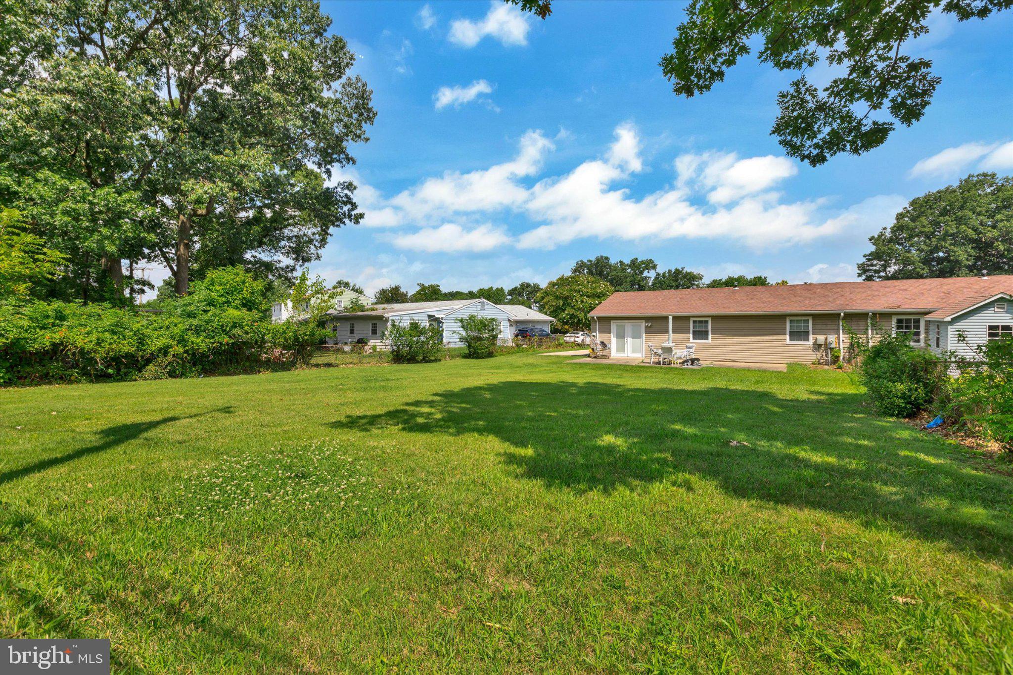 7167 Fairbrook Road Windsor Mill, MD 21244 - Photo 3 of 34 Spacious yard with lush greenery.