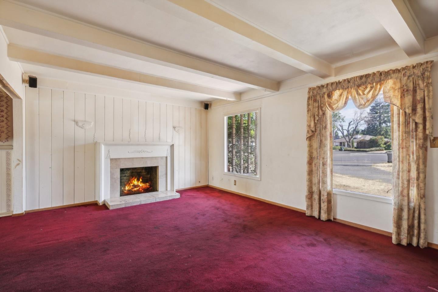 14769 Nelson Way San Jose, CA 95124 - Photo 4 of 43 a view of empty room with a fireplace and fan