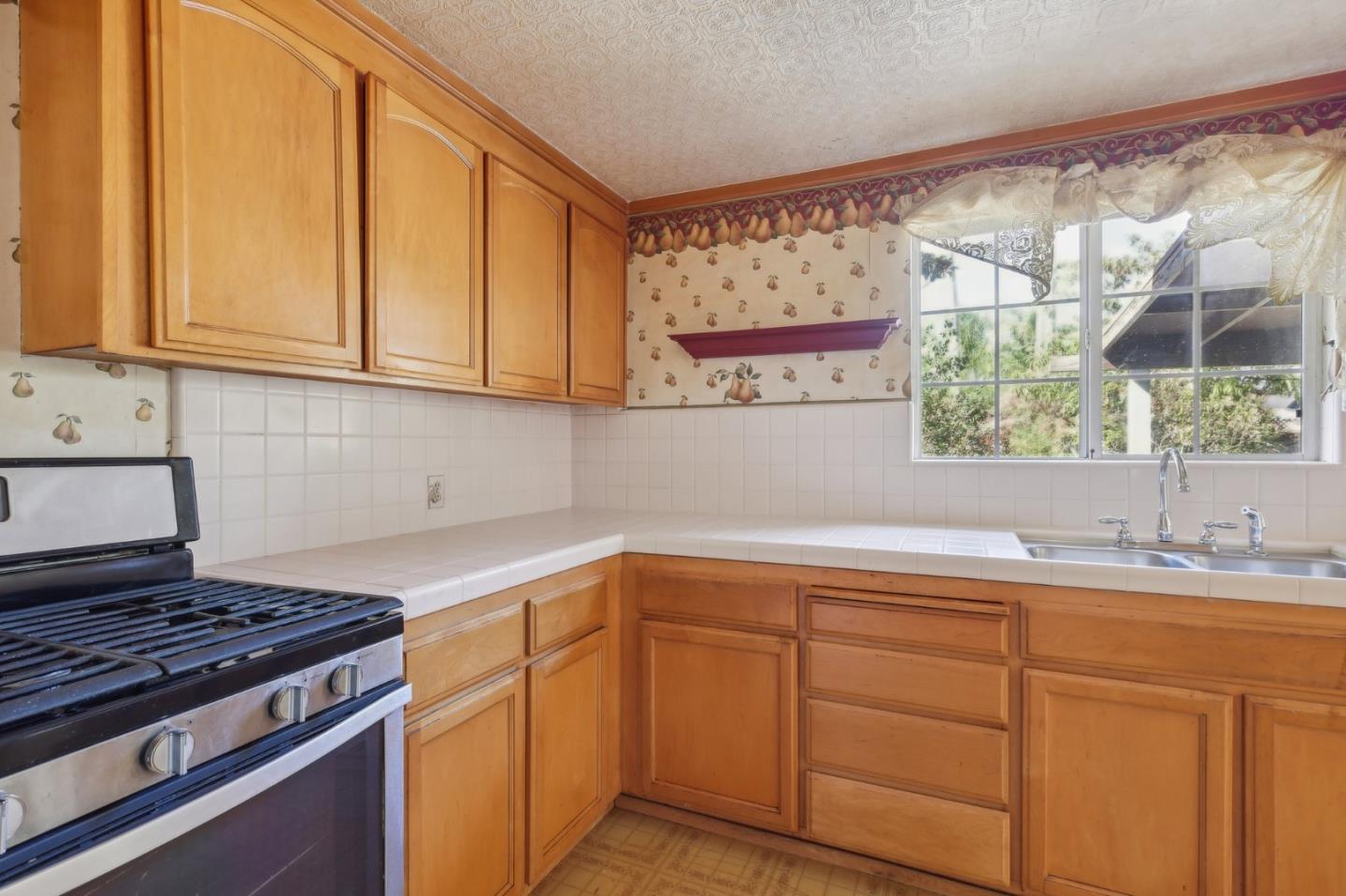 14769 Nelson Way San Jose, CA 95124 - Photo 8 of 43 a kitchen with a sink and cabinets