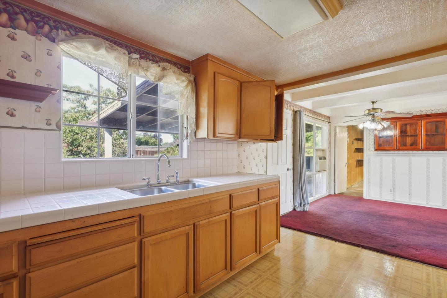 14769 Nelson Way San Jose, CA 95124 - Photo 9 of 43 a kitchen with a sink and cabinets