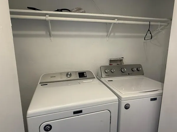 a utility room with dryer and washer