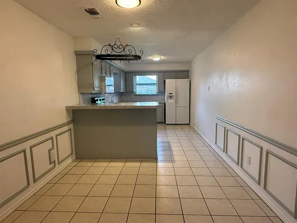 a kitchen with stainless steel appliances a sink stove and cabinets