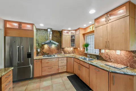 a kitchen with a sink and refrigerator