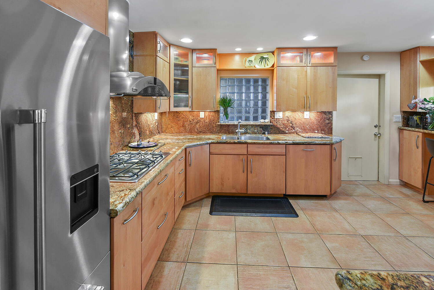 708 Northwest 6th Drive Boca Raton, FL 33486 - Photo 13 of 31 a kitchen with stainless steel appliances granite countertop a stove a sink and a refrigerator