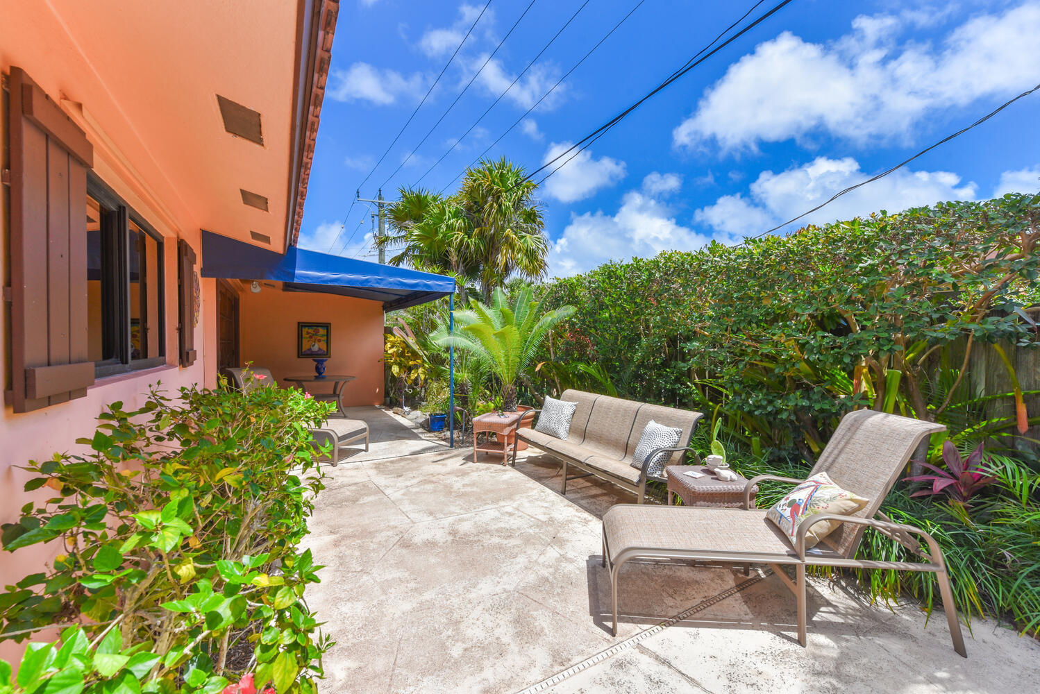 708 Northwest 6th Drive Boca Raton, FL 33486 - Photo 26 of 31 a view of a patio with table and chairs and potted plants