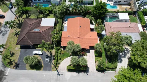 an aerial view of multiple houses with yard