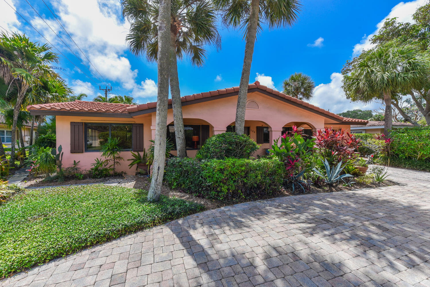 708 Northwest 6th Drive Boca Raton, FL 33486 - Photo 30 of 31 a front view of a house with a garden