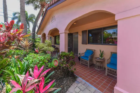 a front view of a house with outdoor seating