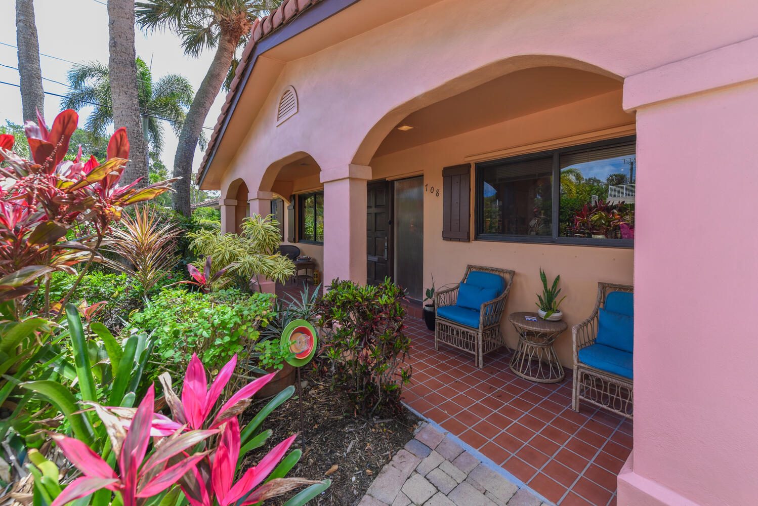 708 Northwest 6th Drive Boca Raton, FL 33486 - Photo 5 of 31 a front view of a house with outdoor seating