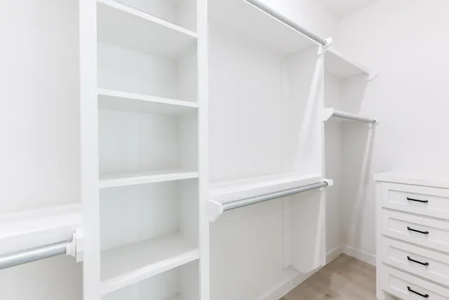 a view of an empty walk in closet