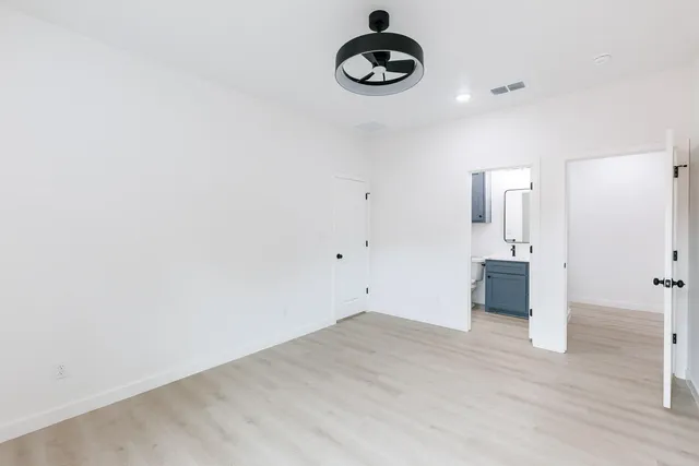 a view of a room with rack and wooden floor