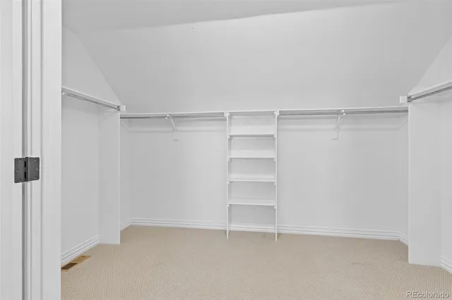 a view of an empty walk in closet