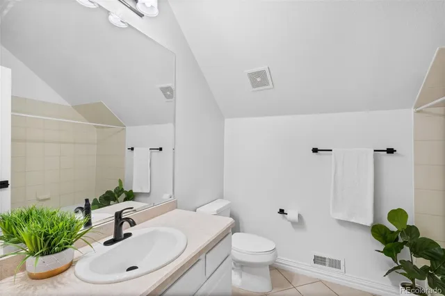 a bathroom with a sink toilet and a mirror