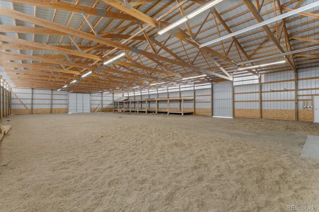 a view of a empty room with wooden ceiling