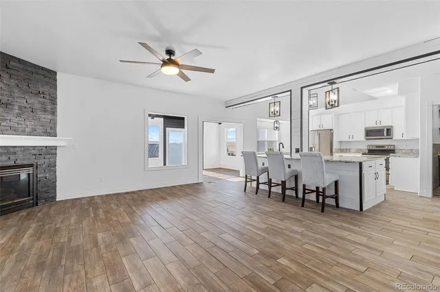 a view of a dining room with furniture window and wooden floor