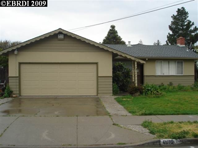 4012 Roland Drive Concord, CA 94521 - Photo 1 of 1 a front view of a house with a yard and garage