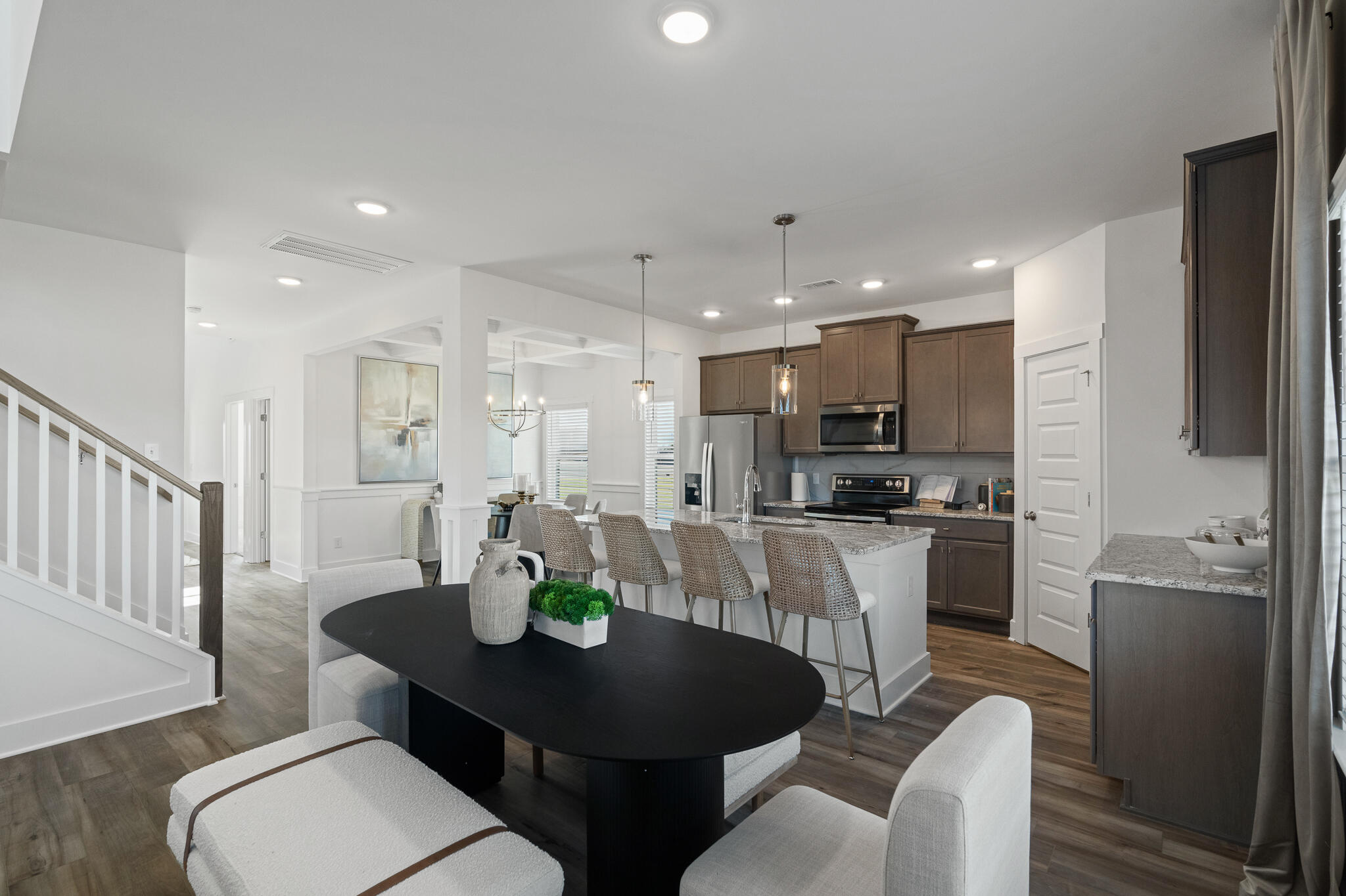 Lot 14 Clarke Hill Road Freeport, FL 32439 - Photo 13 of 58 a kitchen with stainless steel appliances kitchen island granite countertop a dining table chairs and refrigerator