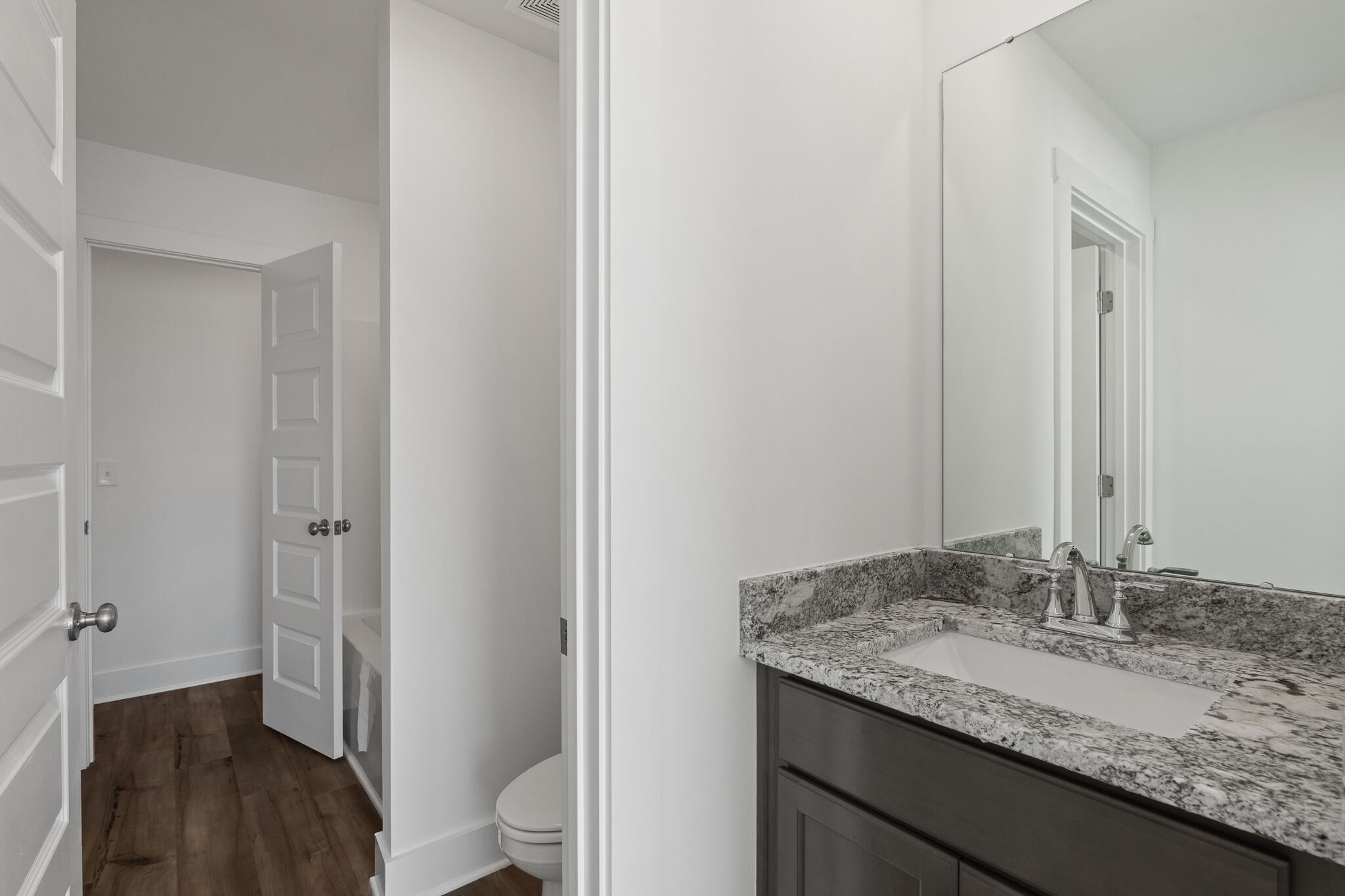 Lot 14 Clarke Hill Road Freeport, FL 32439 - Photo 32 of 58 a bathroom with a granite countertop sink and a mirror