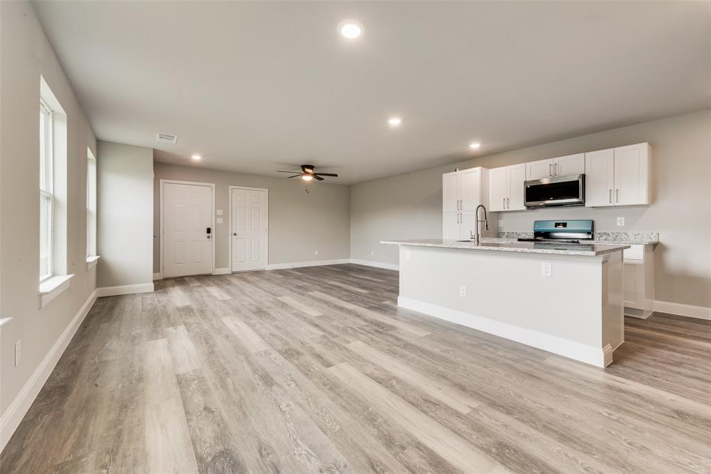 3153 Stag Road Dallas, TX 75241 - Photo 6 of 15 a view of kitchen with wooden floor and electronic appliances