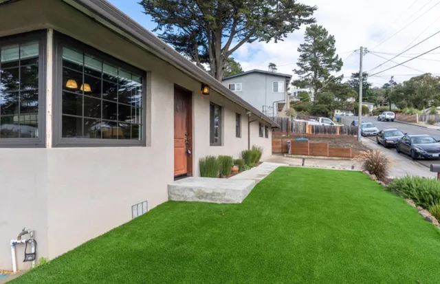 a front view of a house with a yard