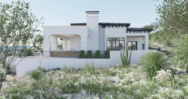 front view of house with a yard and potted plants