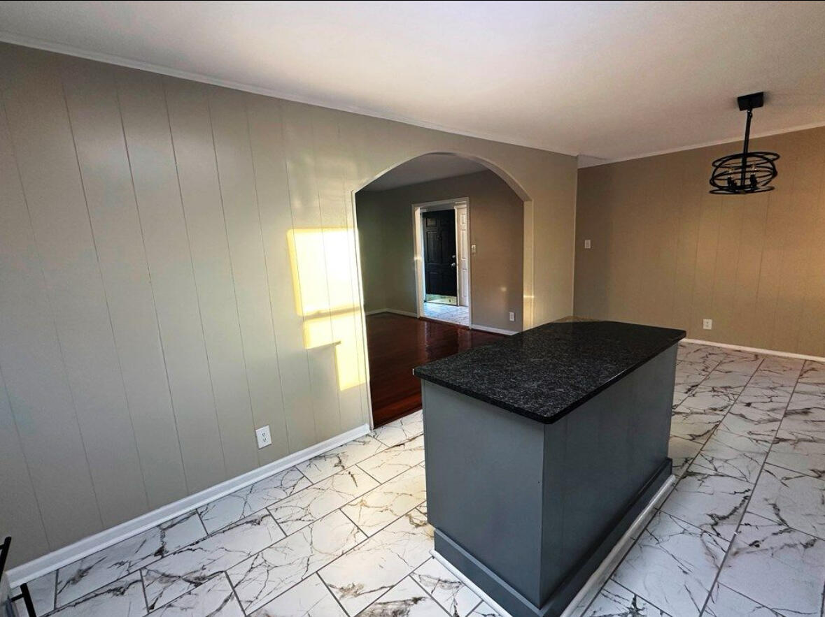 303 Swain Drive Danville, VA 24540 - Photo 11 of 24 a kitchen with granite countertop a sink and a stove