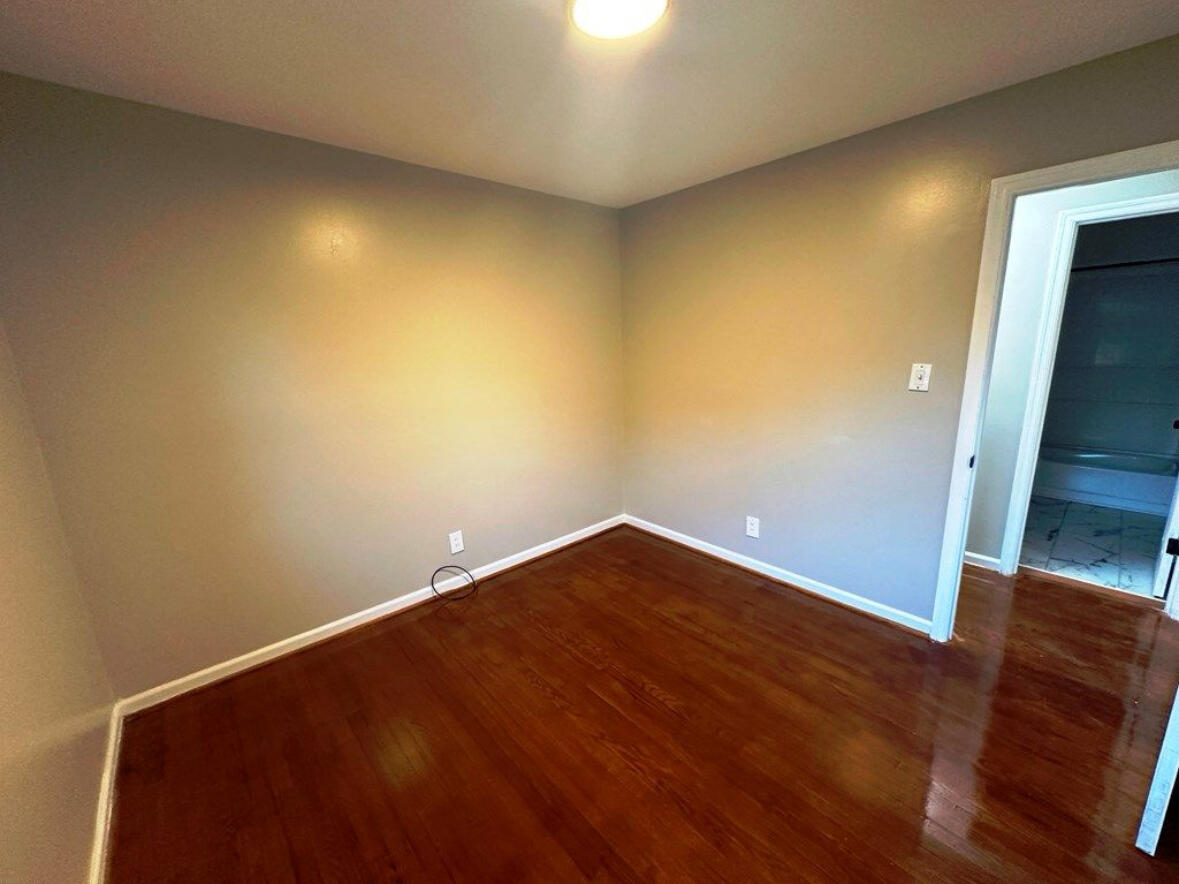 303 Swain Drive Danville, VA 24540 - Photo 14 of 24 an empty room with wooden floor