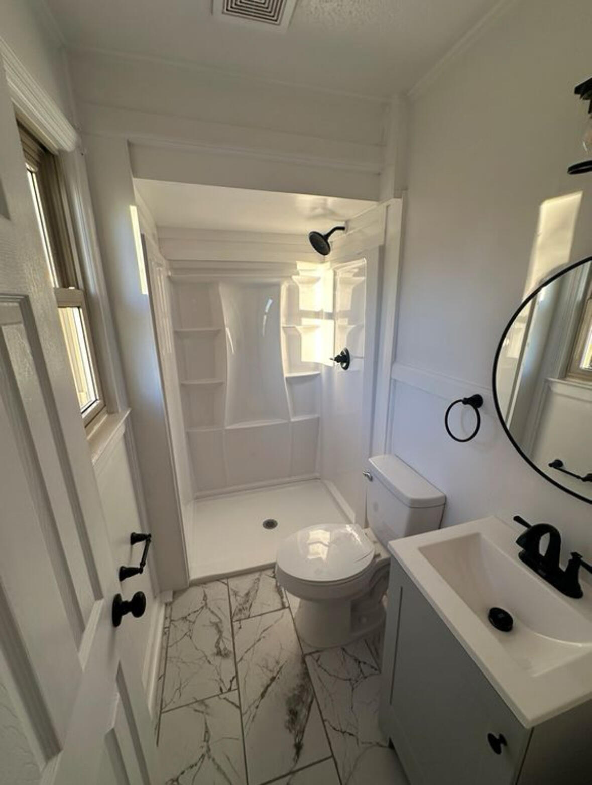 303 Swain Drive Danville, VA 24540 - Photo 20 of 24 a bathroom with a sink toilet and shower