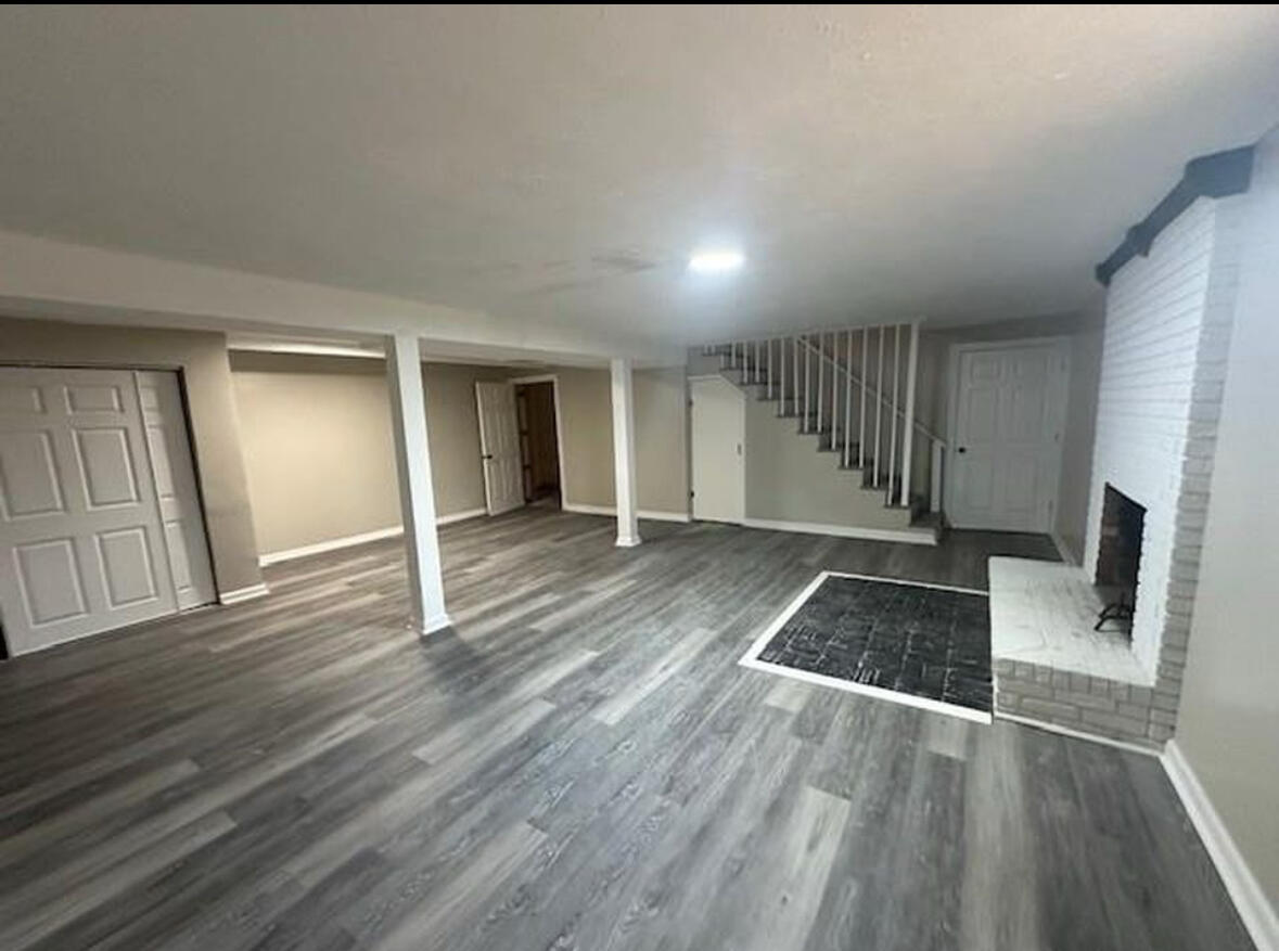 303 Swain Drive Danville, VA 24540 - Photo 23 of 24 a view of a livingroom with wooden floor and staircase