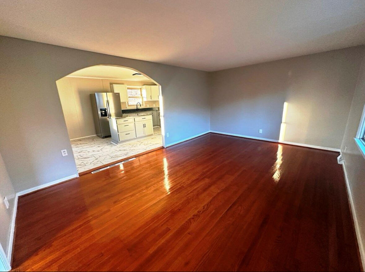 303 Swain Drive Danville, VA 24540 - Photo 4 of 24 a view of empty room with wooden floor