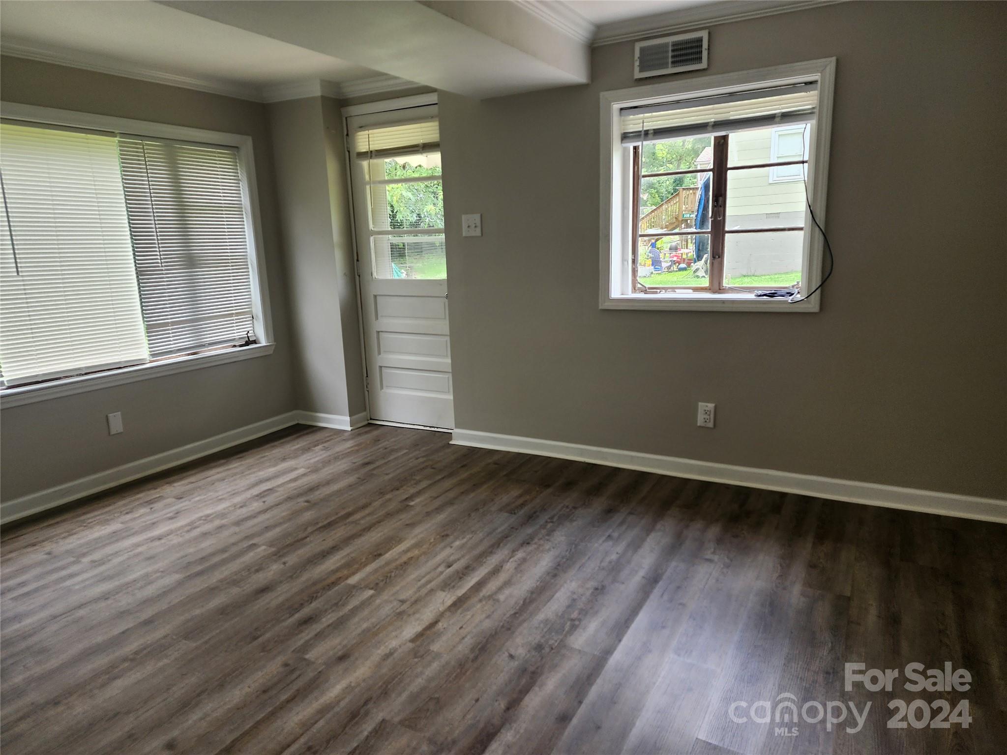 474 Hope Street Rock Hill, SC 29730 - Photo 14 of 18 an empty room with wooden floor and windows