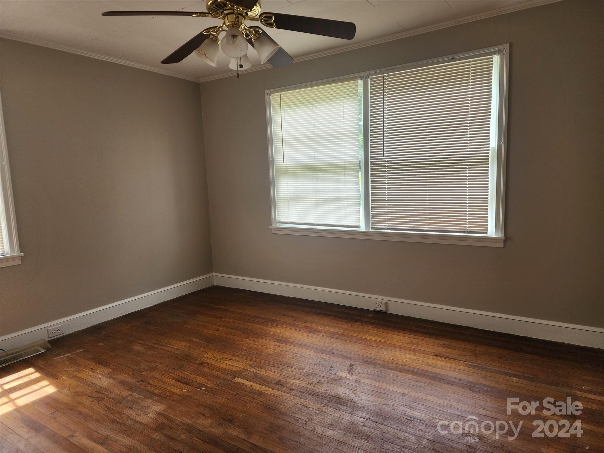 474 Hope Street Rock Hill, SC 29730 - Photo 7 of 18 an empty room with a window and ceiling fan