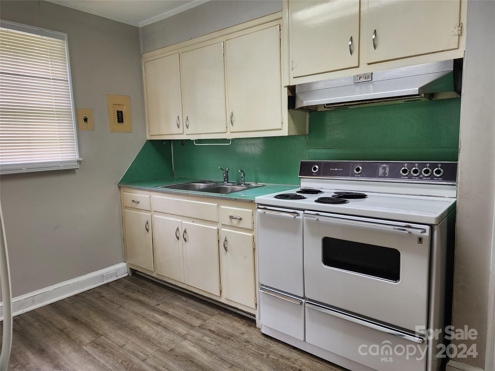 474 Hope Street Rock Hill, SC 29730 - Photo 8 of 18 a kitchen with granite countertop white cabinets and white stove