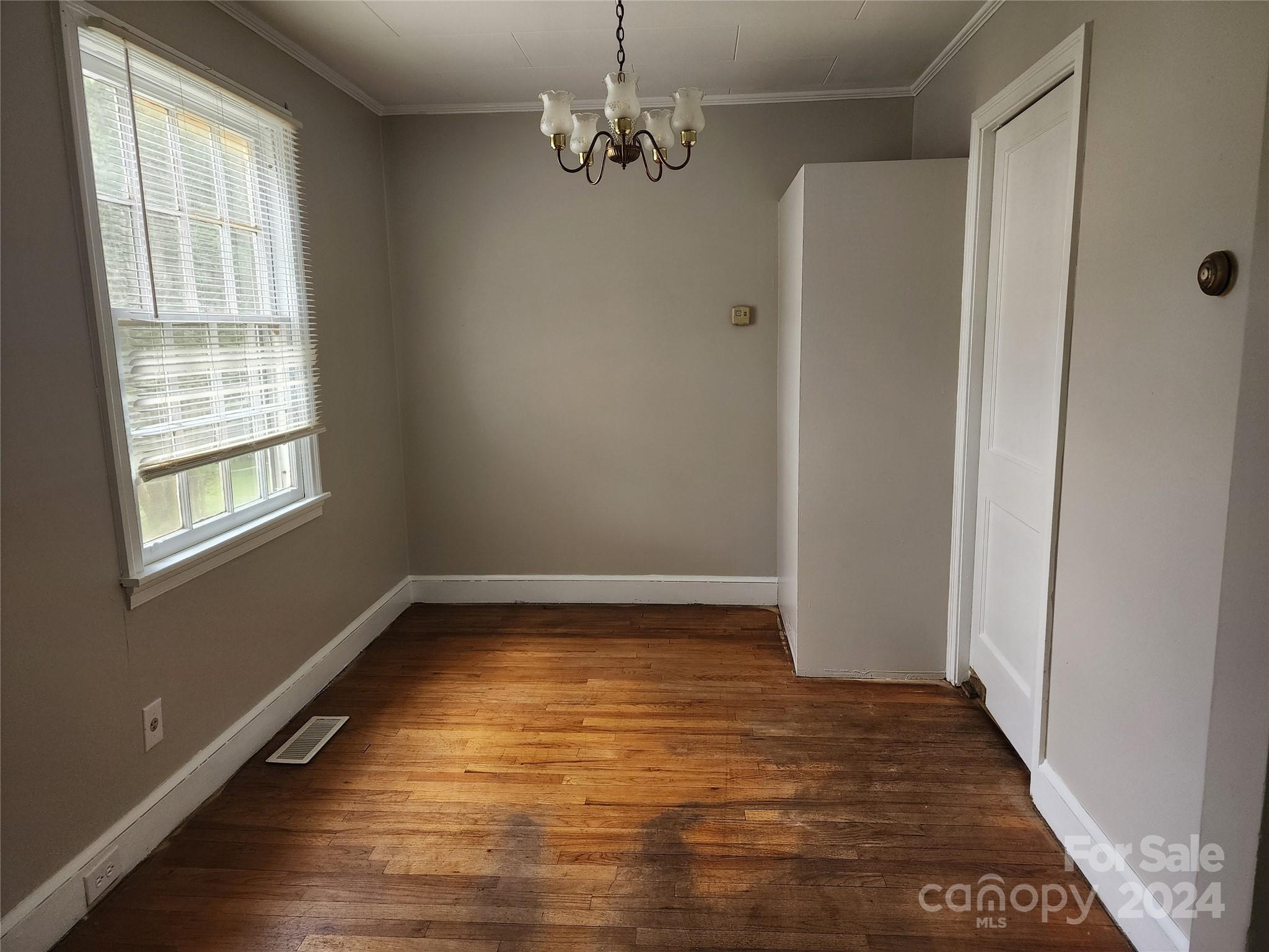 474 Hope Street Rock Hill, SC 29730 - Photo 9 of 18 a view of empty room with window and wooden floor