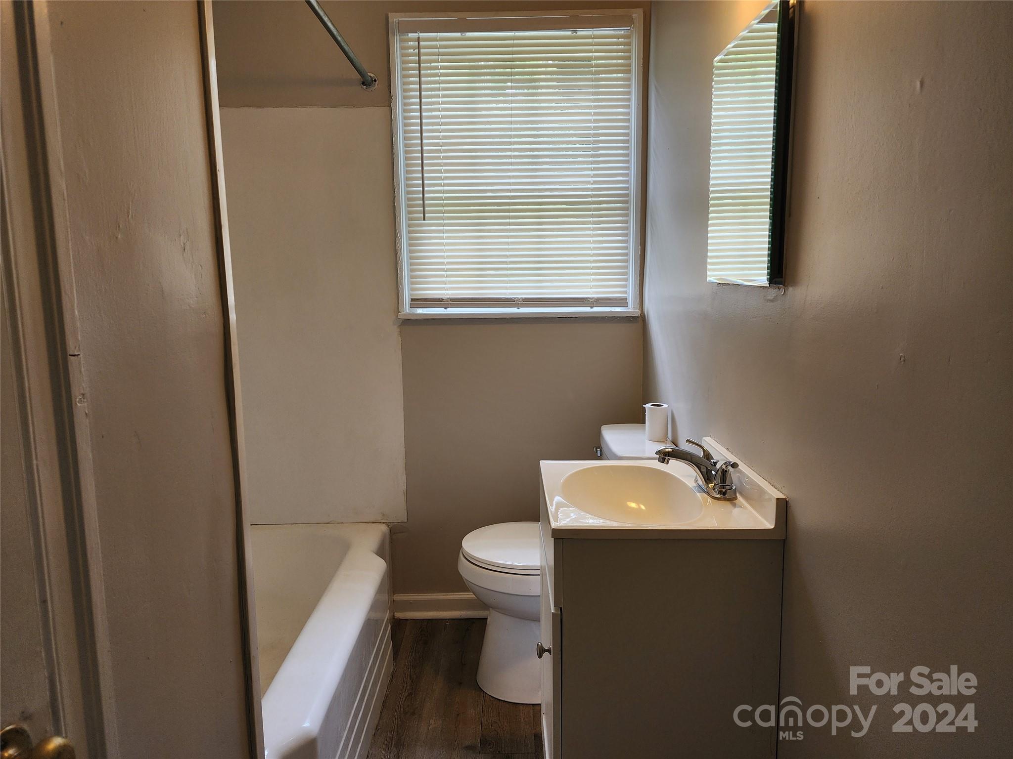 474 Hope Street Rock Hill, SC 29730 - Photo 10 of 18 a bathroom with a sink a toilet and a mirror