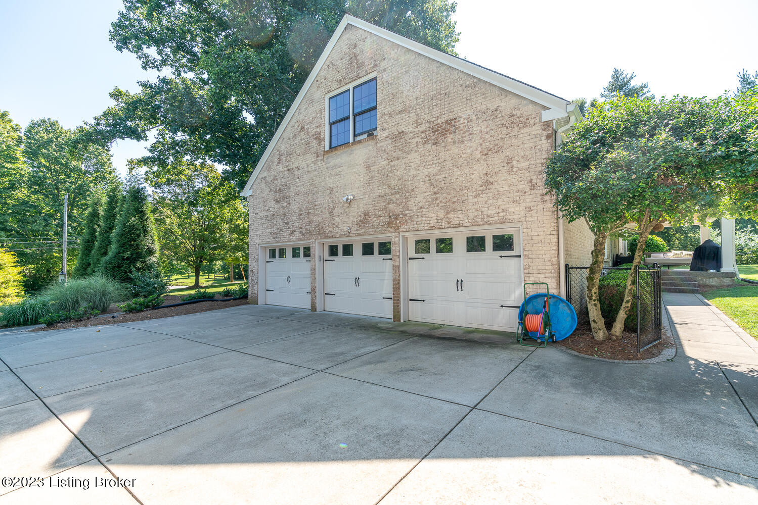 706 Evergreen Road Louisville, KY 40223 - Photo 59 of 65 Large 3 car attached garage and concrete driveway