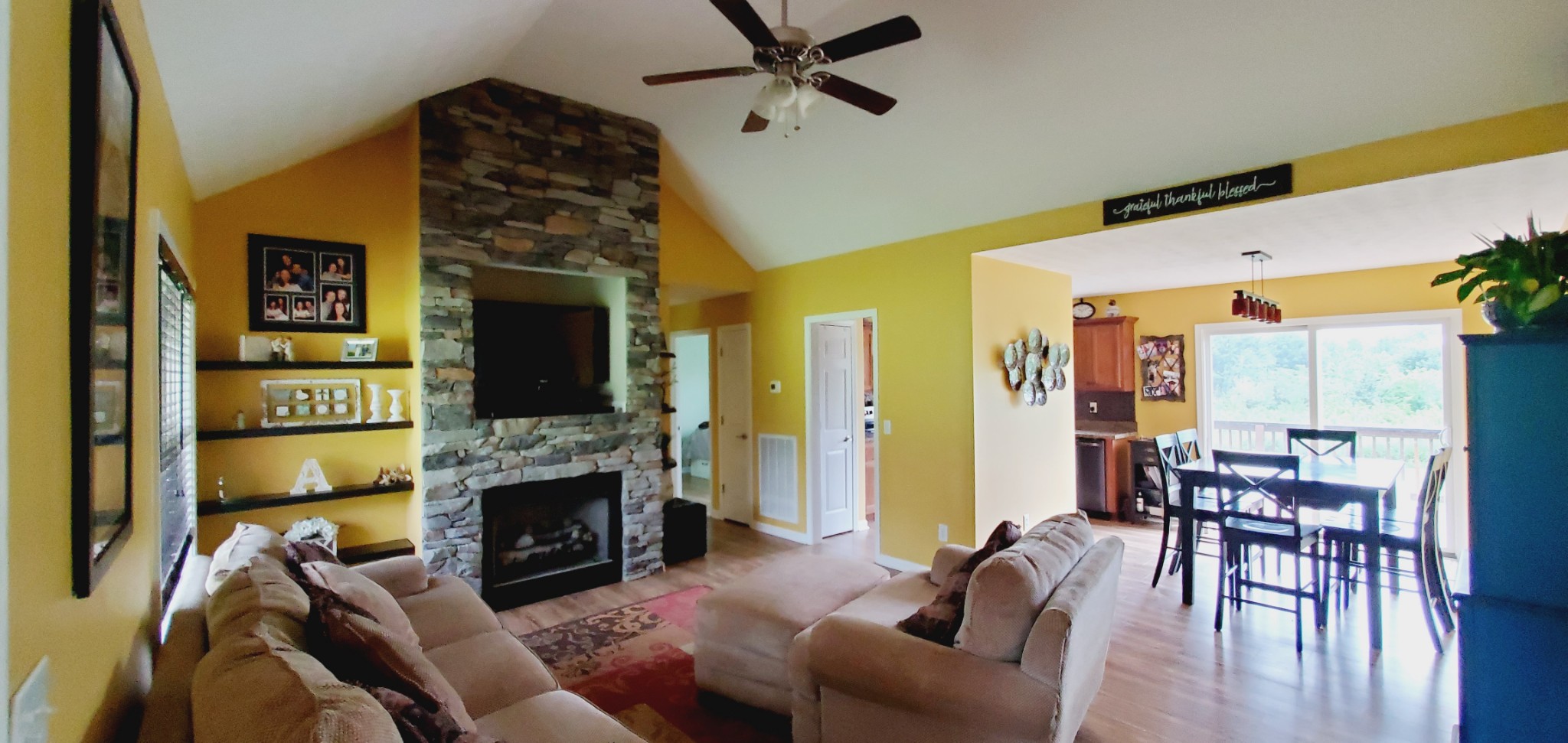 5043 Mt Zion Road Springfield, TN 37172 - Photo 5 of 32 a living room with furniture a flat screen tv and a fireplace