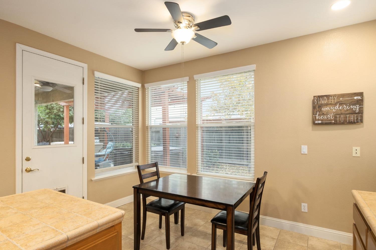 775 South Michelle Avenue Kerman, CA 93630 - Photo 13 of 37 a view of a dining room with furniture and a table