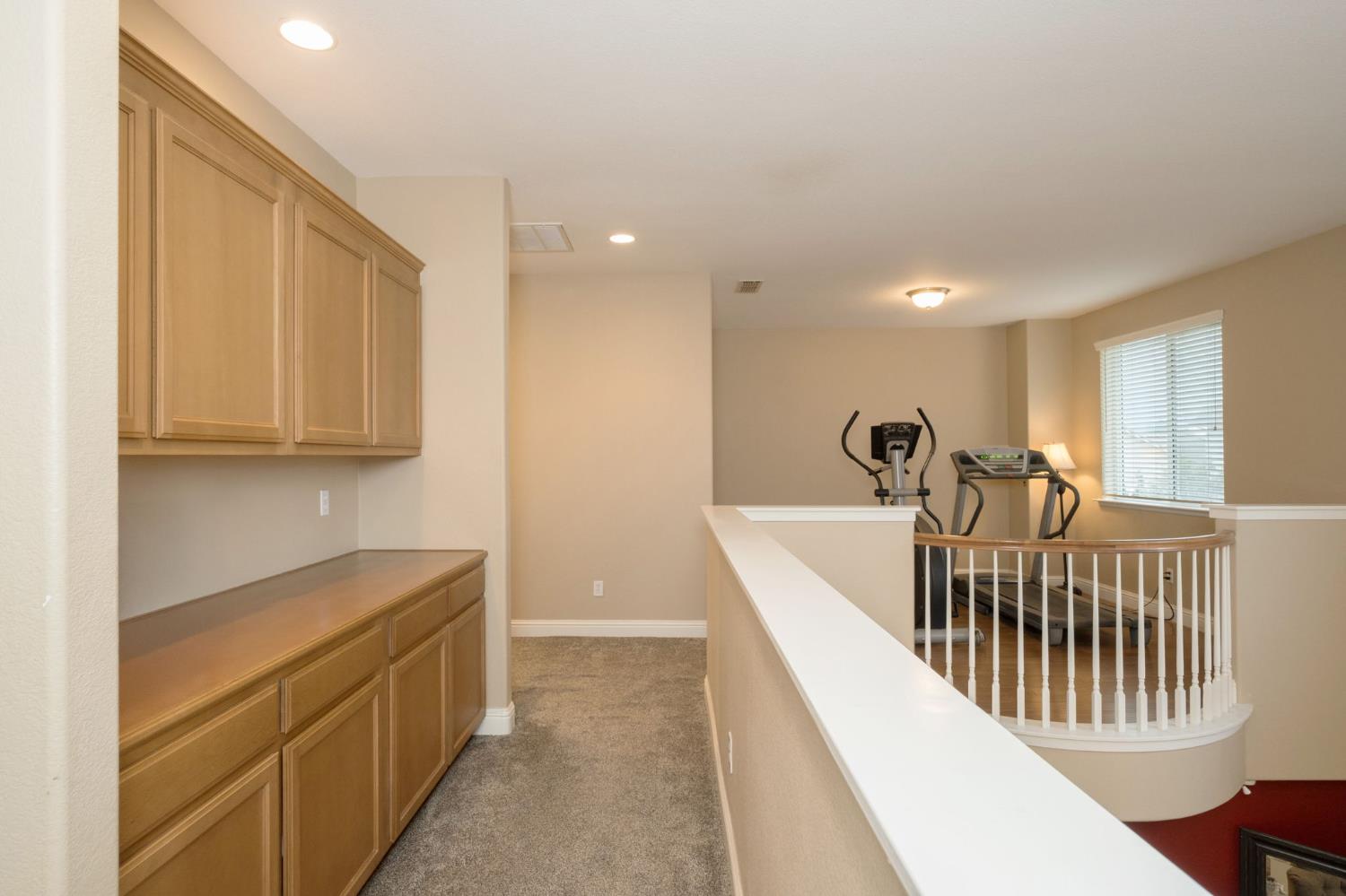 775 South Michelle Avenue Kerman, CA 93630 - Photo 23 of 37 a view of a hallway with seating area