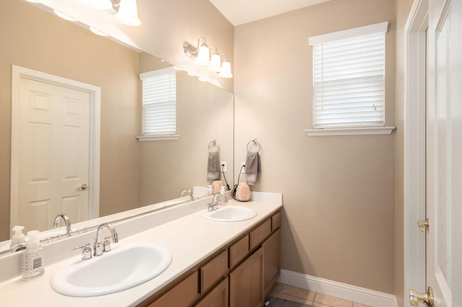 775 South Michelle Avenue Kerman, CA 93630 - Photo 29 of 37 a bathroom with a sink double vanity and a mirror