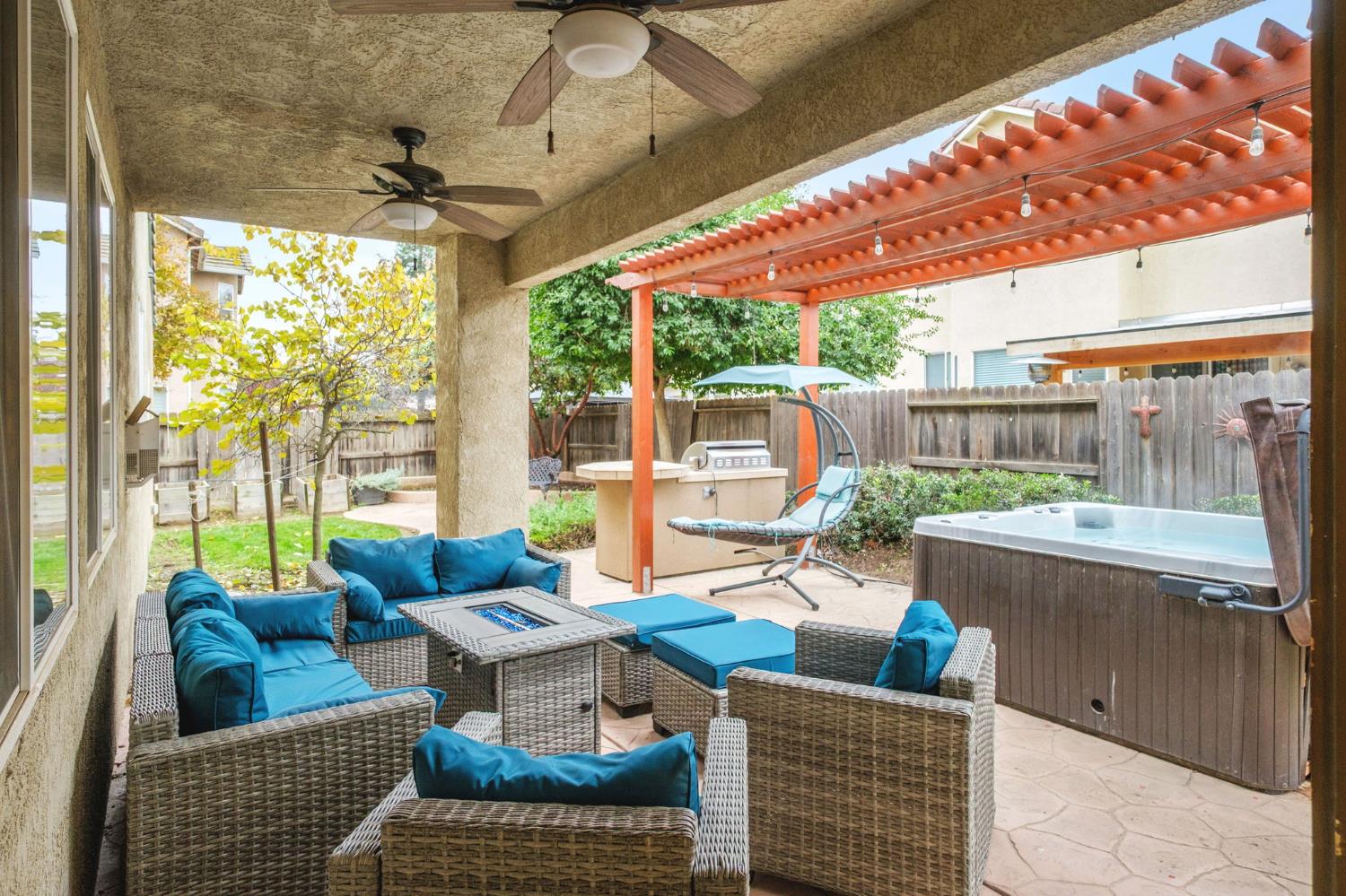775 South Michelle Avenue Kerman, CA 93630 - Photo 31 of 37 a outdoor space with patio the couches and a dining table with the view of garden