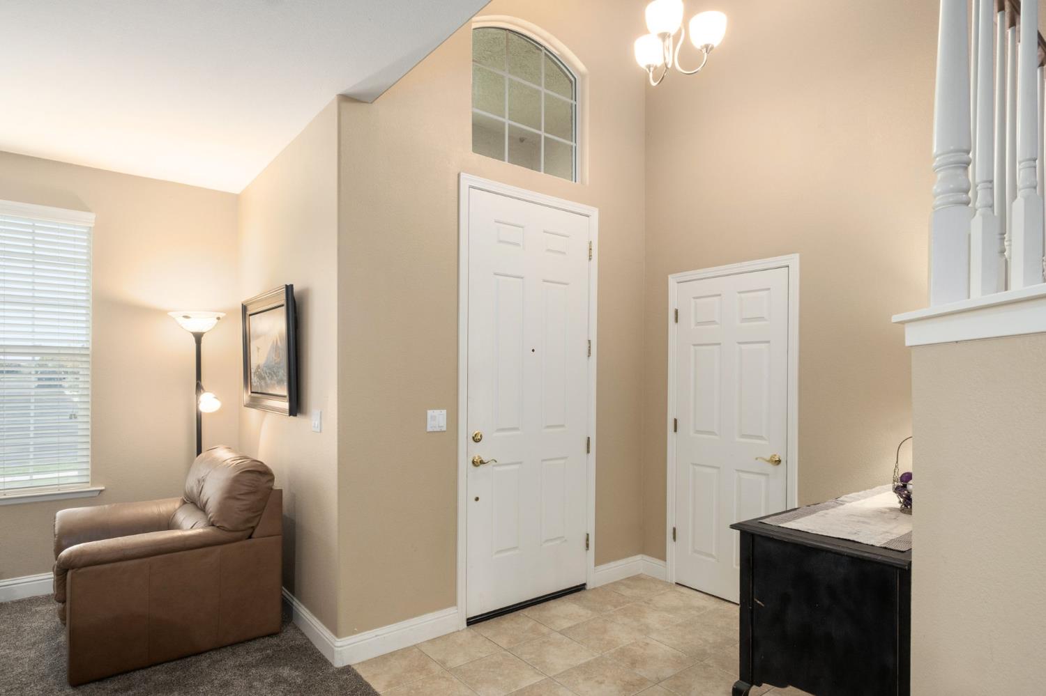 775 South Michelle Avenue Kerman, CA 93630 - Photo 4 of 37 a living room with furniture and a window