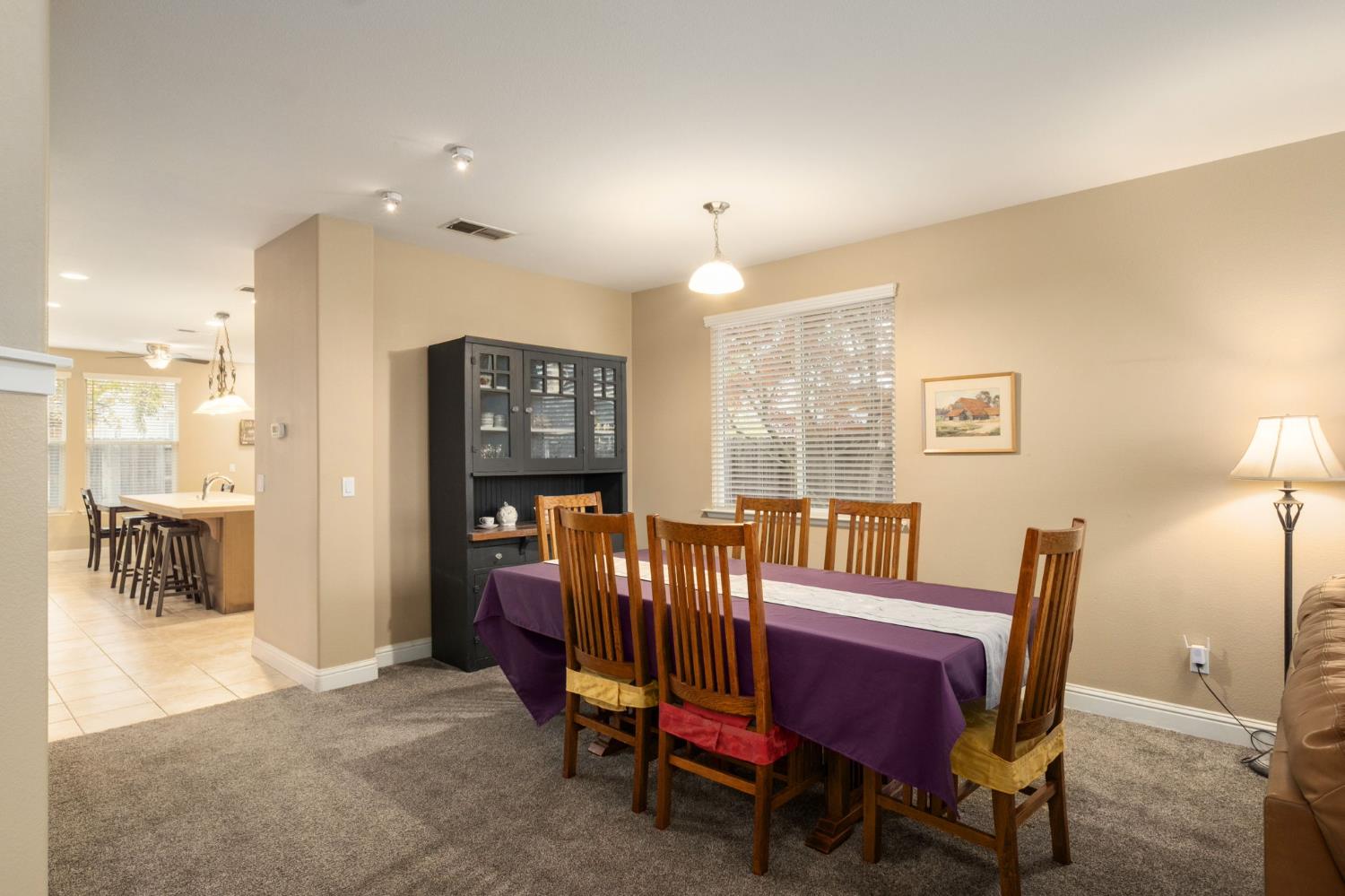 775 South Michelle Avenue Kerman, CA 93630 - Photo 6 of 37 a view of a dining room with furniture window and wooden floor
