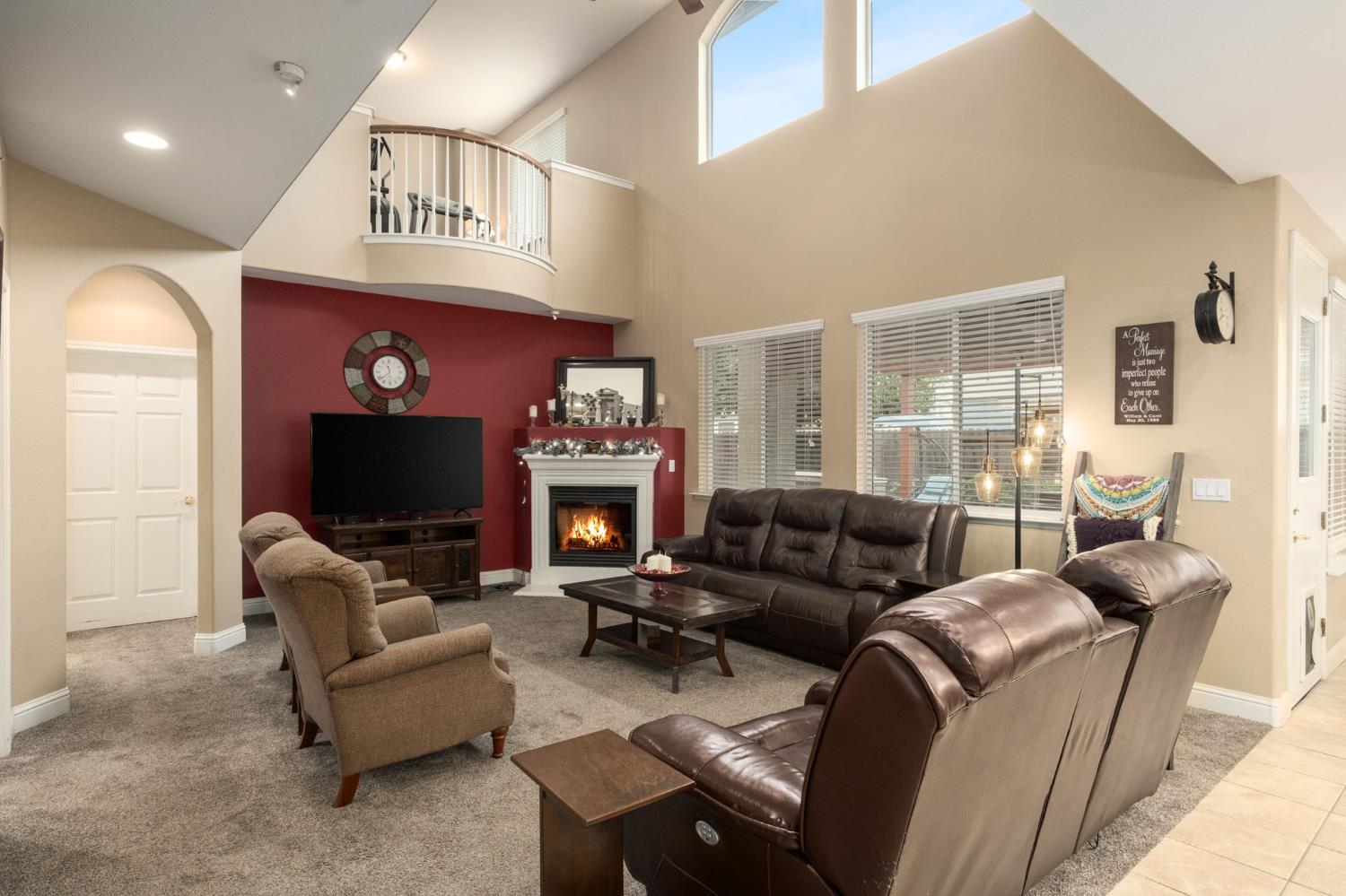 775 South Michelle Avenue Kerman, CA 93630 - Photo 8 of 37 a living room with furniture a fireplace and a flat screen tv