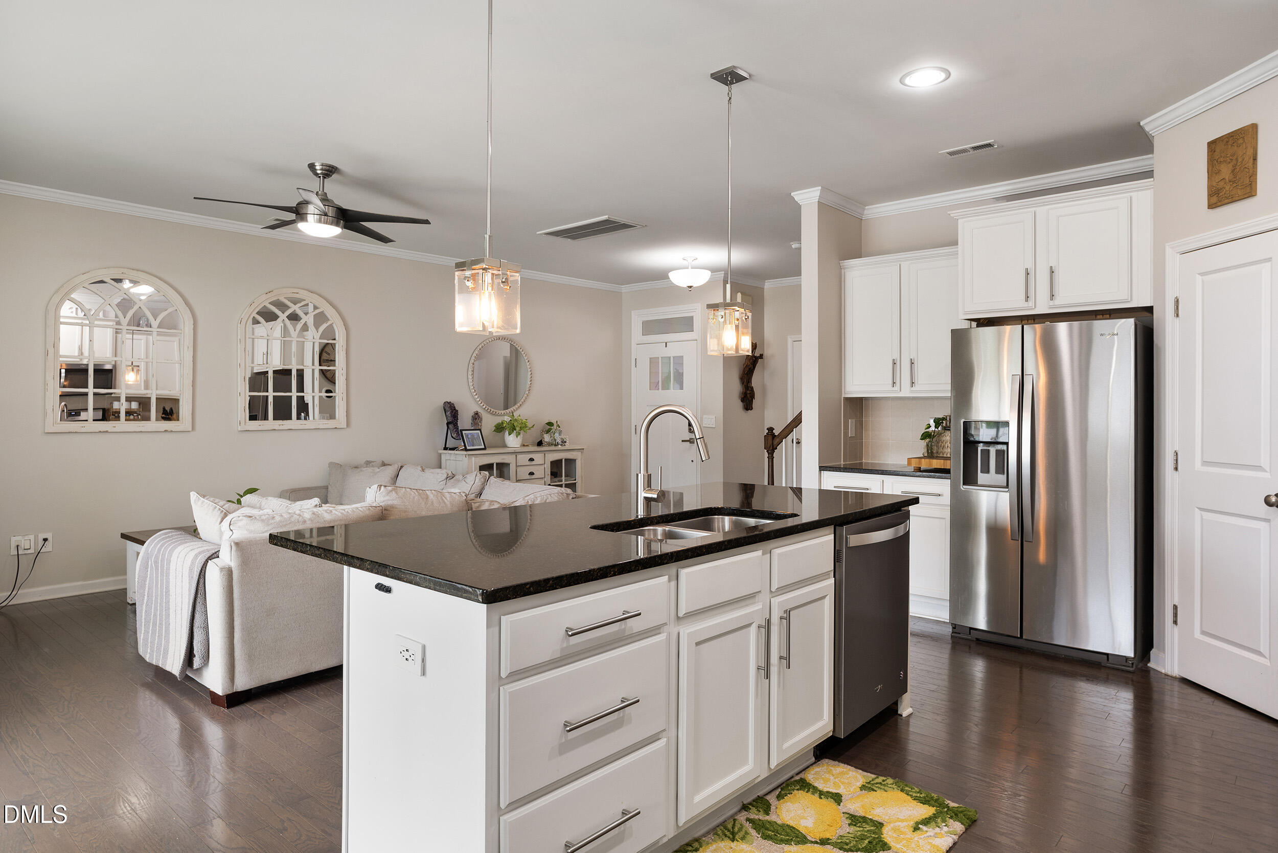 108 Zante Currant Road Durham, NC 27703 - Photo 17 of 33 a kitchen with stainless steel appliances a sink a refrigerator a center island a stove and a cabinets