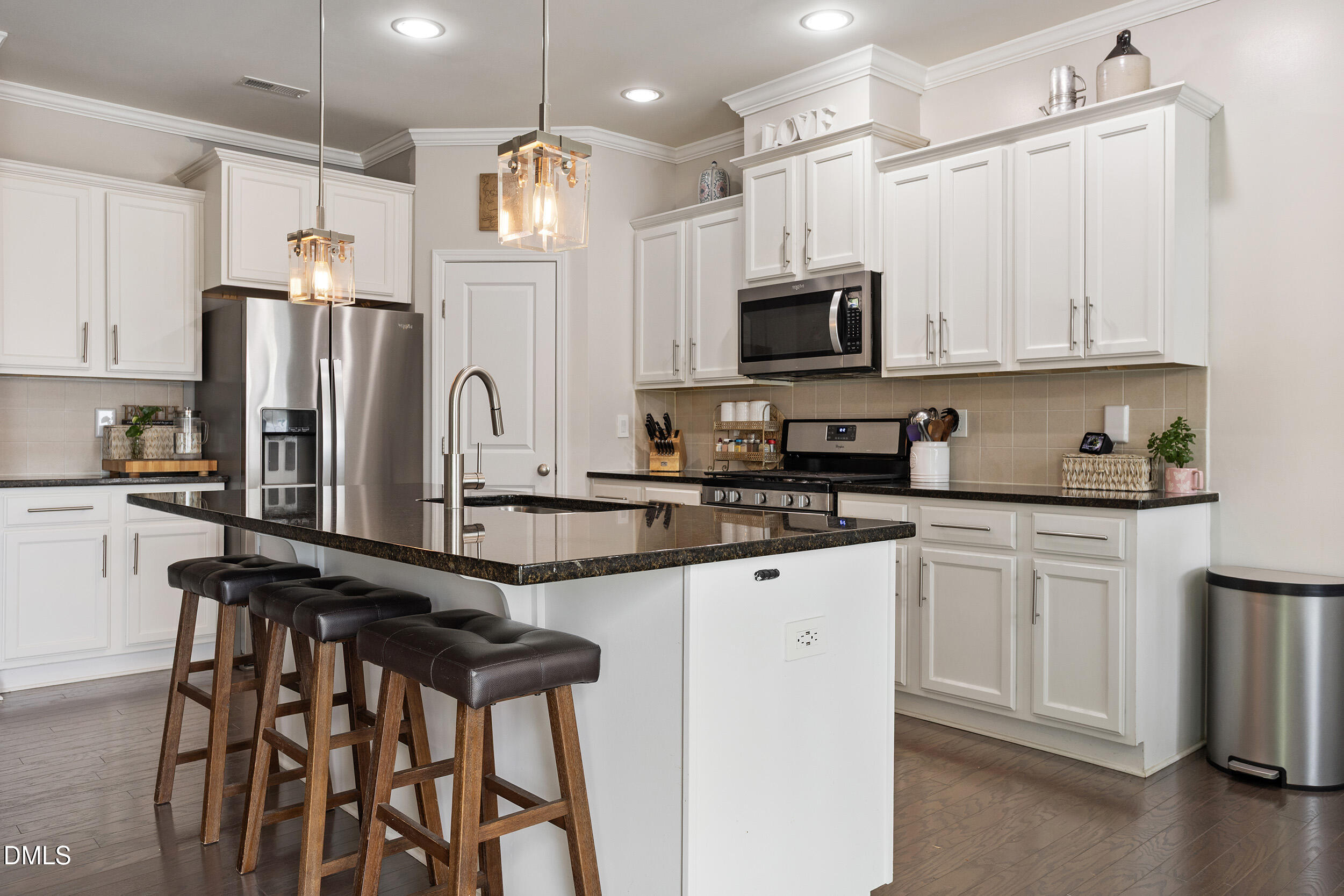 108 Zante Currant Road Durham, NC 27703 - Photo 18 of 33 a kitchen with granite countertop a refrigerator stove top oven and sink